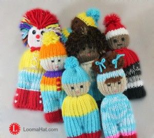 a group of knitted dolls sitting next to each other