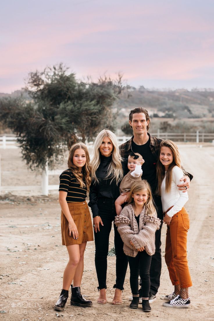 a family posing for a photo with the caption tips for taking family photos