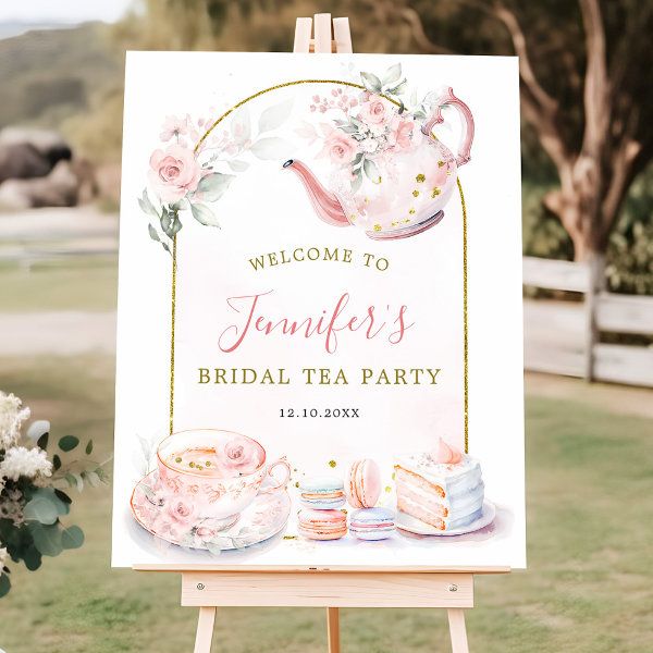 a welcome sign for a bridal tea party with pink flowers and cake on it