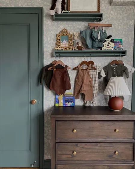 a dresser with some clothes on top of it