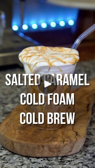 salted caramel cold foam cold beer in a glass with a spoon on top