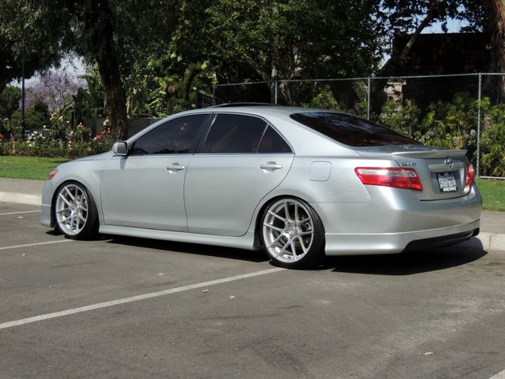 a silver car parked in a parking lot