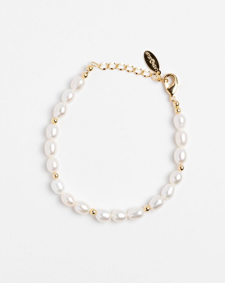 Handmade bracelet. Fresh water pearl with gold-plated round charms. Length: 6" with 1" adjustable chain. Made in USA. Classic Adjustable Chain Bracelet With Pearl Charm, Adjustable Gold Bracelets With Pearl Drop, Adjustable Gold Charm Bracelet With Pearl Chain, Adjustable Gold-plated Bracelets With Pearl Charm, Adjustable Gold Pearl Drop Bracelet, Adjustable Gold Plated Bracelets With Pearl Charm, Classic Adjustable Gold Bracelet With Pearls, Gold Pearl Rosary Bracelet With Pearl Charm, Adjustable Gold Pearl Bracelet With Pearl Charm