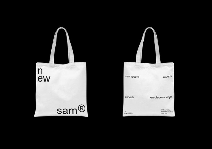 two white bags with the same logo on them, one in black and one in white