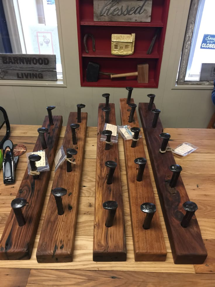 several pieces of wood sitting on top of a wooden table next to a bottle opener