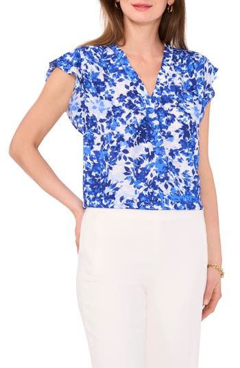 Fluttering sleeves frame this lively printed blouse topped with a dipped neckline and punctuated with a curved hem. 27" length V-neck Short sleeves 100% polyester Machine wash, tumble dry Imported Blue Flutter Sleeve Blouse For Spring, Summer Workwear Tops With Butterfly Sleeves, Spring Flowy Blouse With Split Neck, Elegant Short Sleeve Top With Floral Print, Chic Flowy Blouse With Split Neck, Flowy Split Neck Blouse For Spring, Spring Printed Blouse With Butterfly Sleeves, Chic Printed Blouse With Flutter Sleeves, Chic Flowy Split Neck Blouse