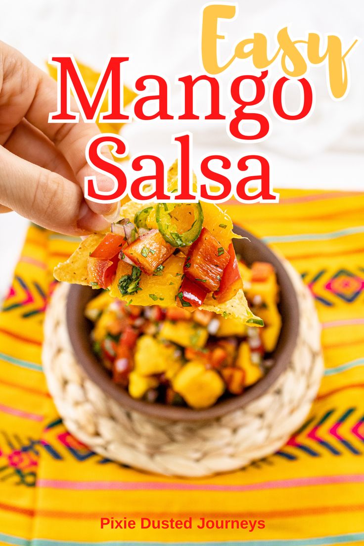 easy mango salsa in a bowl with a hand holding it up to the camera and text overlay that reads easy mango salsa