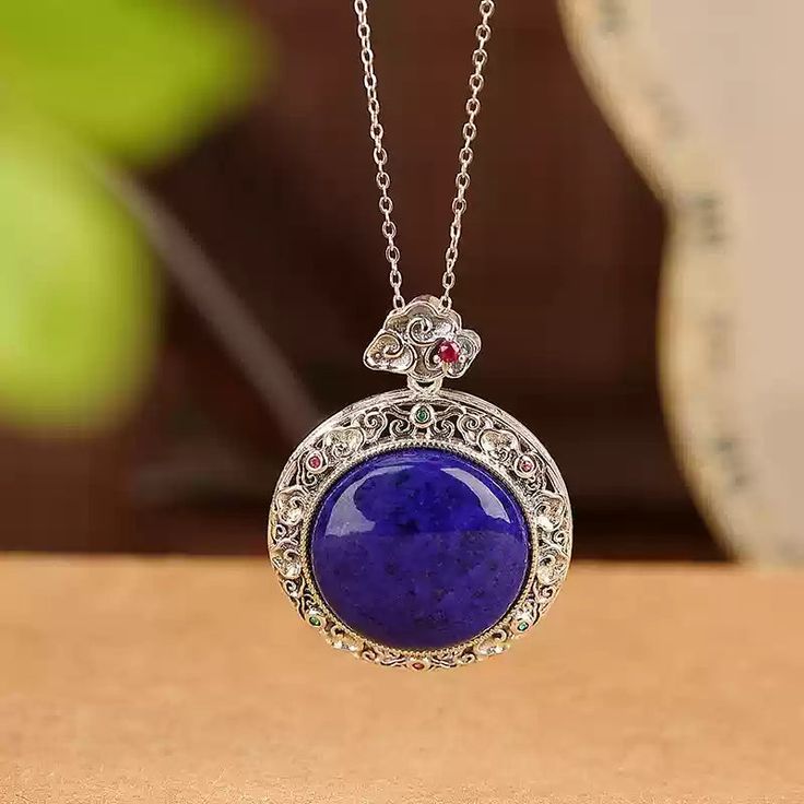 Material: S925 Sterling Silver with Gold PlatingGemstone: Lapis Lazuli, approximately 20mmWeight: Approximately 8.5gSize: Pendant Diameter: 28mm, Total Length: 36mm Description:This Lapis Lazuli Pendant Necklace showcases the captivating deep blue hue of a 20mm natural lapis lazuli gemstone, set in an intricately designed gold-plated S925 sterling silver frame. The ornate detailing around the pendant adds a vintage-inspired elegance, while the addition of colorful accent stones enhances its allure. The necklace's refined chain complements the pendant, creating a balanced, eye-catching piece. Perfect for adding a pop of color and a touch of sophistication to any outfit, this necklace is a must-have for lovers of unique and timeless jewelry. Note: The natural properties and composition of mi Lapis Lazuli Pendant, Lapis Lazuli Gemstone, Natural Stones Necklace, Pearl Jewelry Necklace, Gold Statement Earrings, Natural Stone Jewelry, Natural Stone Bracelets, Timeless Jewelry, Anklet Jewelry