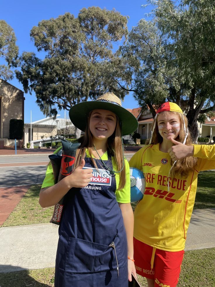 two girls in costumes posing for the camera