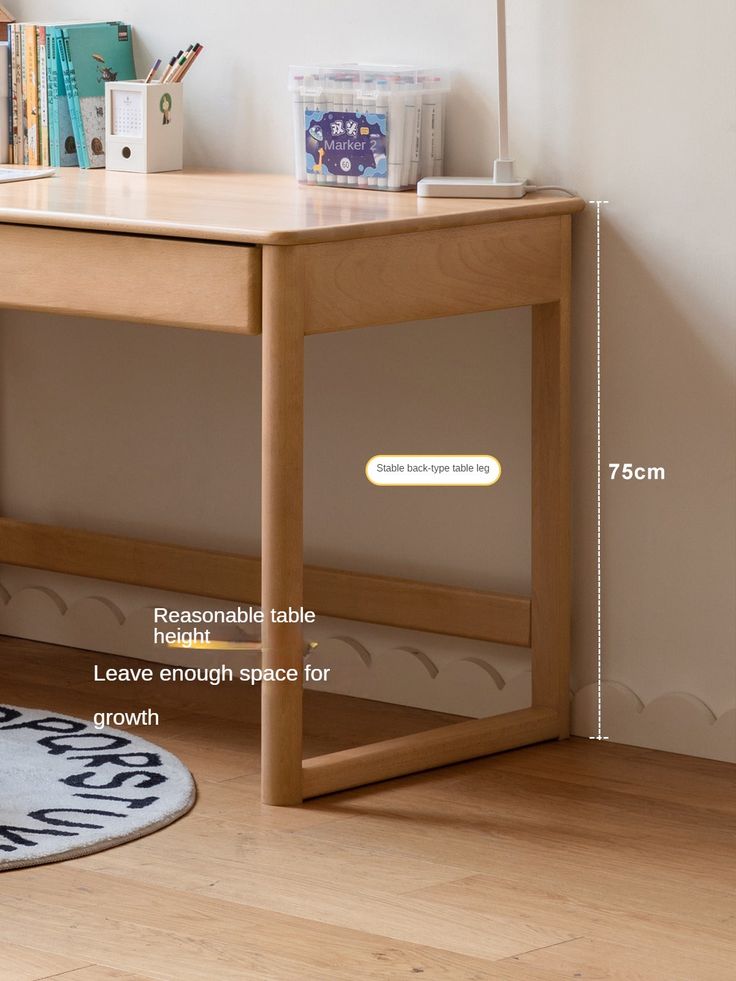 a wooden desk sitting on top of a hard wood floor next to a white rug