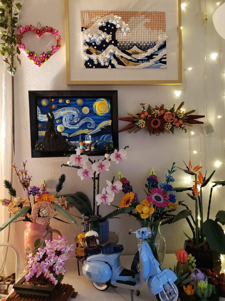 there are many flowers and pictures on the wall