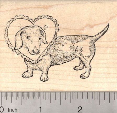 a rubber stamp with a dachshund holding a heart