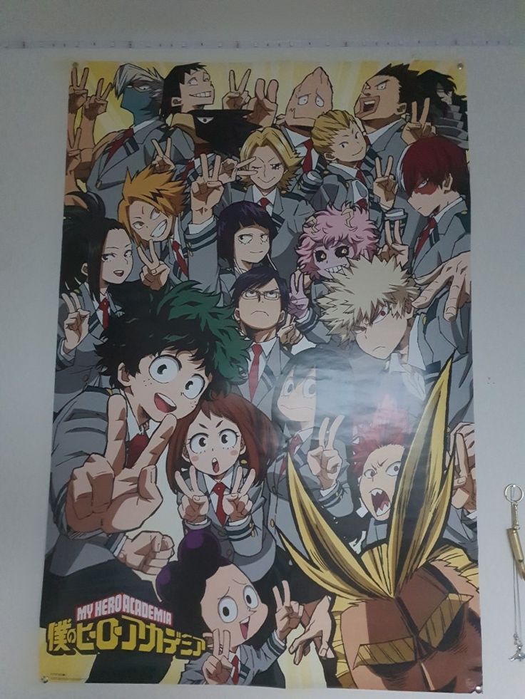 an anime poster hanging on the wall with many people around it and one person holding his hand up