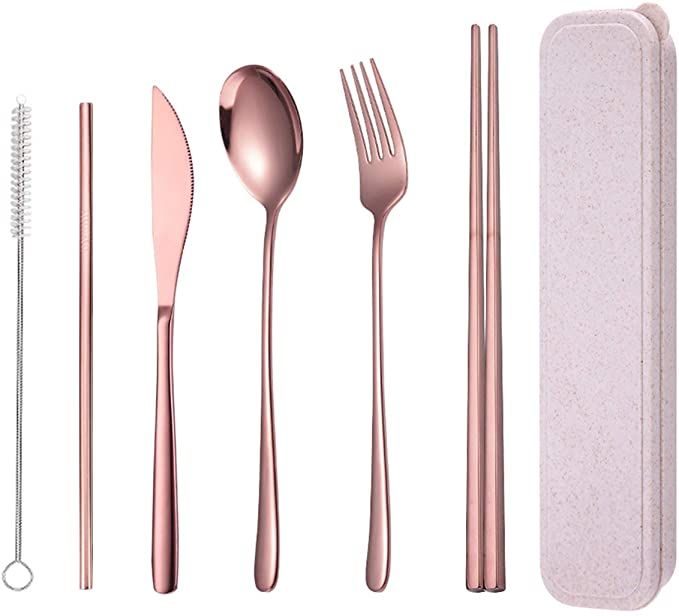 an assortment of pink utensils and spoons