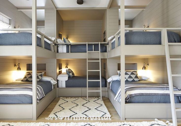 a room with bunk beds and lights in it