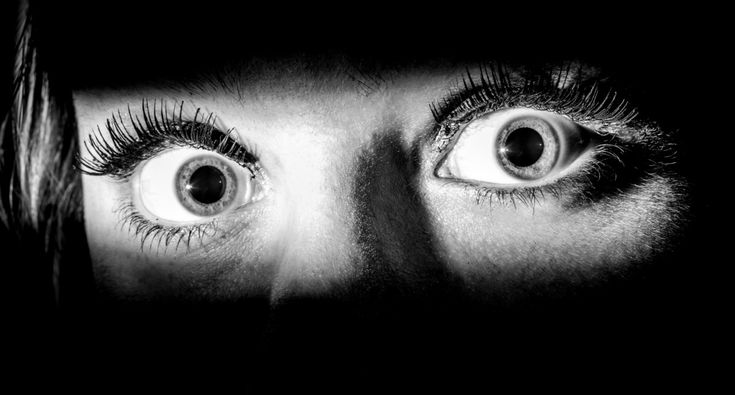 the eyes of a woman with long lashes are shown in this black and white photo