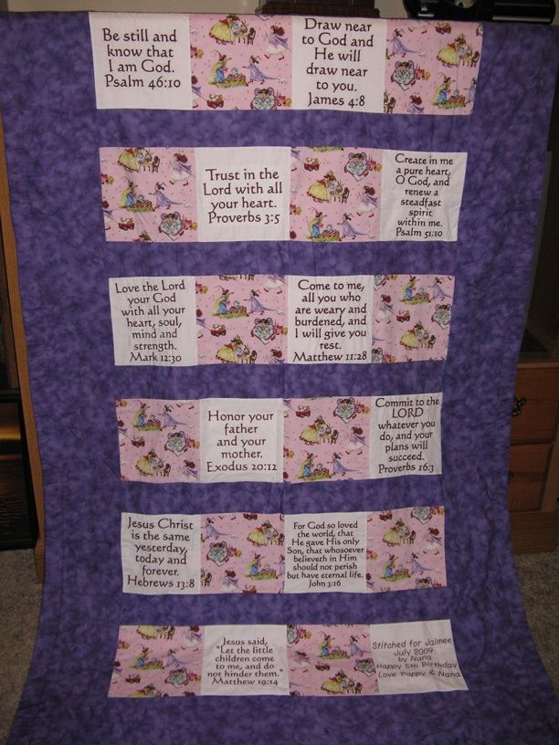 a purple quilt with some words on it