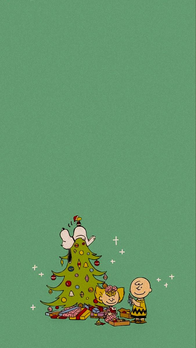 peanuts around the christmas tree with charlie brown and snoop on it's back ground