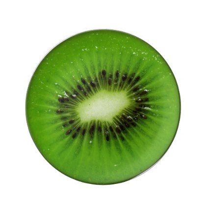 a green kiwi cut in half on a white background