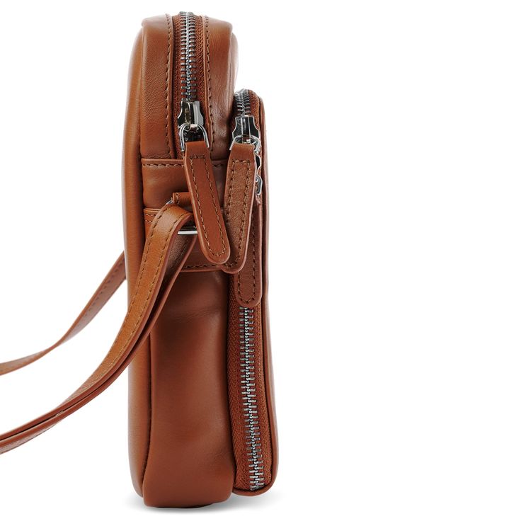 * Genuine leather develops a distinct patina
 * Keep your pockets empty and your phone safe
 * Convenient shoulder strap Leather Mobile Phone Bag, Mobile Phone Bag, Phone Bag, Card Wallet, Cognac, Front Pocket, Sleek Design, Patina, Mobile Phone