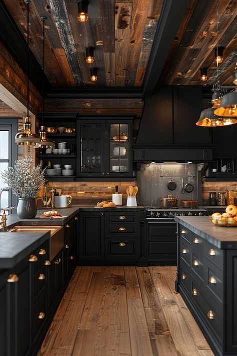 a kitchen with black cabinets and wooden floors, lights hanging from the ceiling over the stove