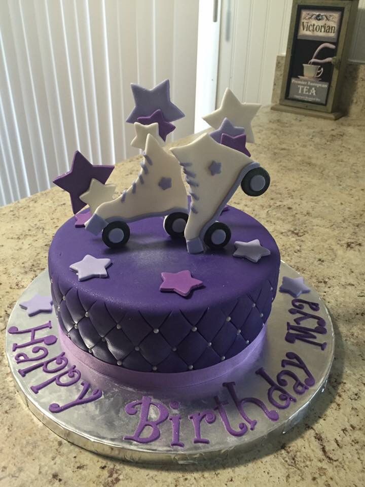 a purple birthday cake with stars and wheels on the top that says happy birthday to you