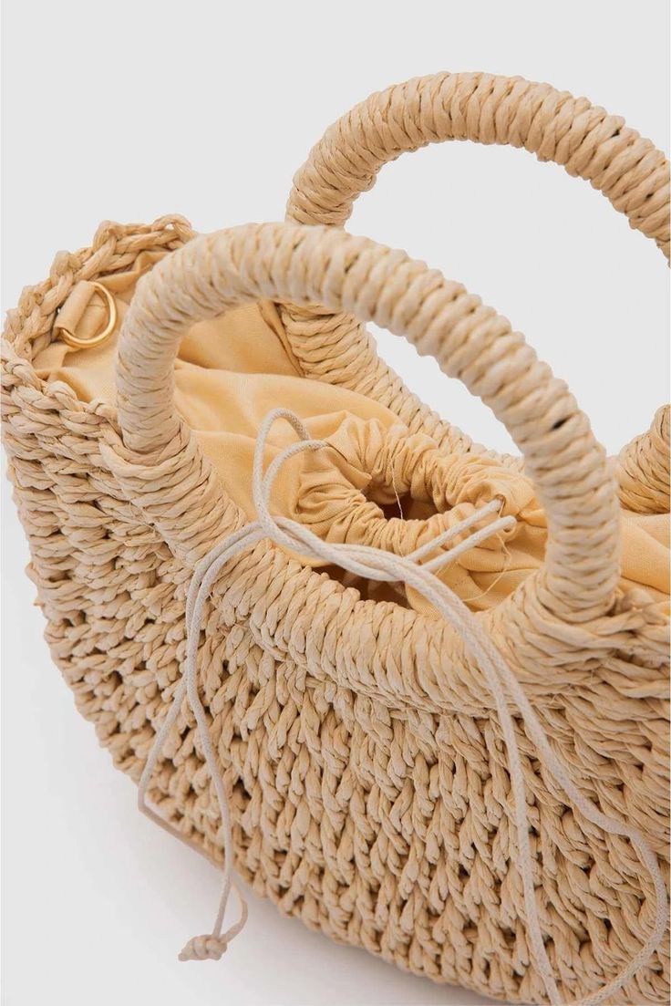 Designed with Lunarity Garage handmade natural straw weaving, Wendy Women's Straw Handbag offers an option that will add elegance to your wardrobe on hot summer days. This bag is a stylish and comfortable choice at the beach, picnic or any summer event. Its medium size is ideal for carrying all the essentials you need for daily use. The warm color of the natural wicker makes the bag unique and goes well with any combination.The Lunarity garage Camel/ Beige Straw Handbag offers users a sturdy han Chic Beige Braided Crochet Bag, Chic Natural Straw Bag With Round Handle, Chic Straw Bag For Spring Picnic, Chic Spring Straw Bag For Picnic, Trendy Beige Braided Straw Bag, Chic Woven Beach Bag With Round Handle, Trendy Straw Bag With Round Handle For Beach, Trendy Summer Beach Bag With Round Handle, Trendy Beach Bag With Round Handle For Summer