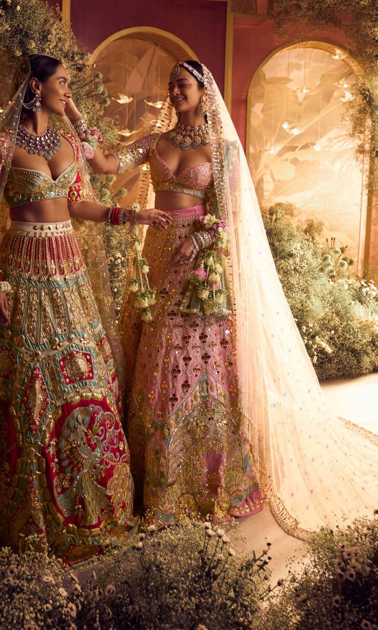 Introducing our royal carriage bridal lehenga set - a regal masterpiece. Embroidered with crystals, gold tassels, beads, and 3d floral motifs, it features custom initials for a personal touch. Paired with a baby pink and teal blouse, delicate tassels, and bangle back. Completed with embroidered pink tulle and fluid organza dupattas. Baby Pink Bridal Lehenga, Royal Carriage, Pink Bridal Lehenga, Desi Dress, Traditional Indian Dress, Teal Blouse, Indian Dresses Traditional, Traditional Indian Outfits, Indian Bridal Outfits