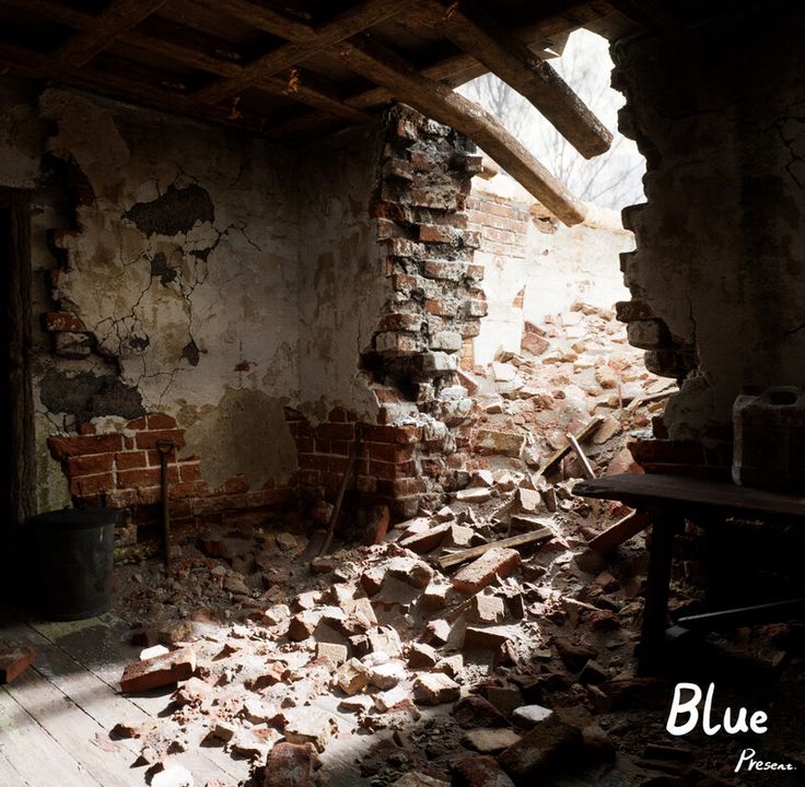 an old run down room with bricks and debris on the floor