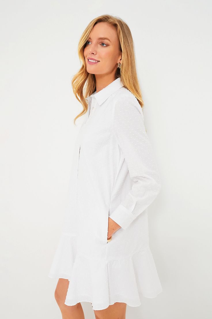 A sophisticated update to the closet staple shirt dress we love, the White Swiss Dot Callahan perfectly merges classic and trendy. This mini seamlessly combines functional details like invisible side pockets and a button front half placket with a flirty flutter hemline to create a style that encapsulates unfussy femininity. We are pairing this tailored piece with flats or sneakers for a casual look and switching to heels when the occasion calls for it. Classic collar Long sleeves with button cuf Fitted White Mini Dress With Swiss Dot, Classic White Button-up Dress, White Shirt Dress With Buttons, Mini Length, White Button-up Dress With Placket, Chic White Button-up Mini Dress, Closet Staples, Swiss Dot, Cocktail Attire, White Shirt Dress