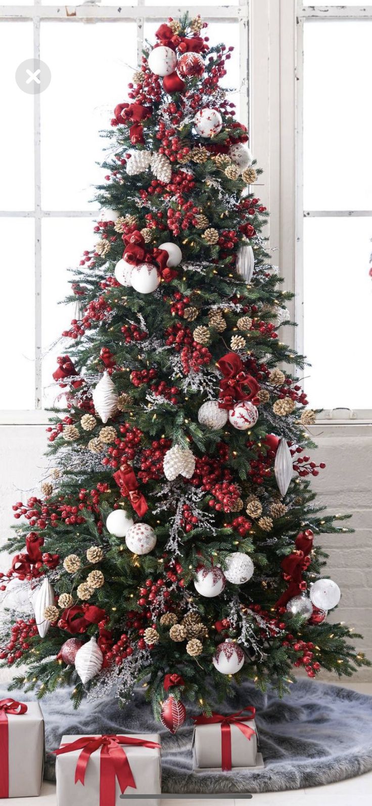 a decorated christmas tree with presents under it