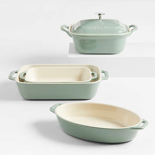 three green casserole dishes with lids and handles