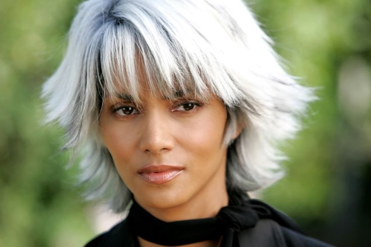 a woman with white hair and gray eyes