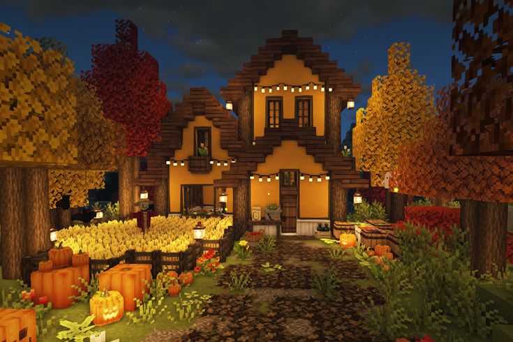 a house with pumpkins in the yard and lights on it's front windows