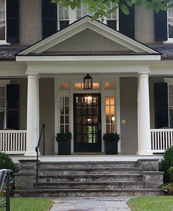 the front porch of a house with steps leading up to it