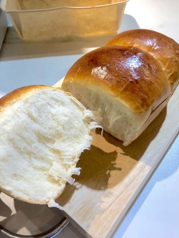 a loaf of bread sitting on top of a cutting board