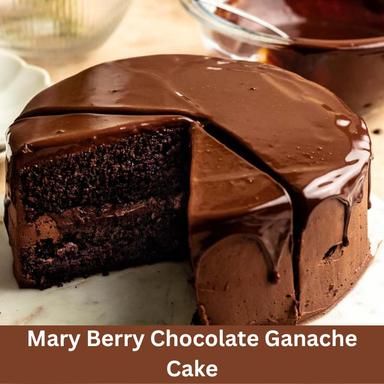 there is a chocolate ganache cake with one slice cut out and ready to be eaten