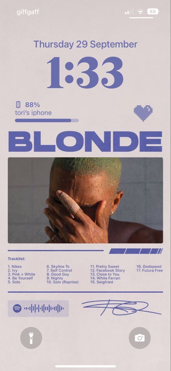 the poster for blonde is displayed in front of a white wall with blue writing on it