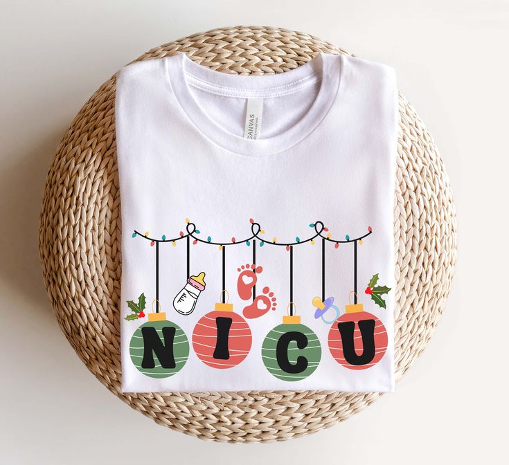 a white t - shirt with the word nicu hanging from it's strings