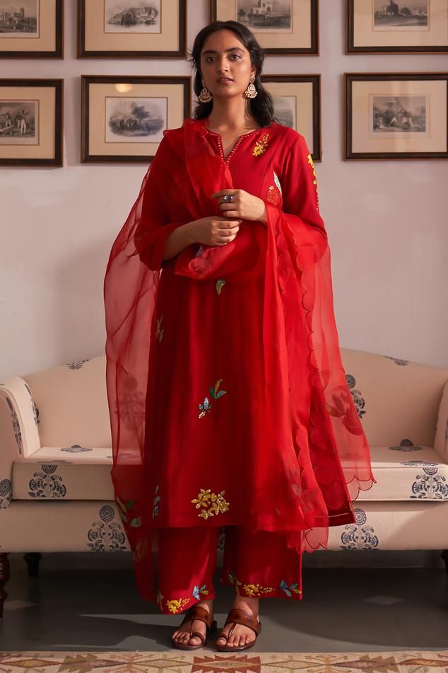 Red hand woven cotton kurta with sequins and applique embroidery. Paired with embroidered pant and scallop border dupatta.
Components: 3
Pattern: Embroidered
Type Of Work: Floral
Neckline: Notched
Sleeve Type: Three quarter
Fabric: Mangalgiri cotton 
Color: Red
Other Details: 
Side slits
Scallop border dupatta
Length:
Kurta: 46 inches
Pant: 38 inches
Approx. product weight: 1-3 kg
Model height: 5ft 7inches, wearing size M
Occasion: Puja - Aza Fashions Appliqué Work, Blouse Yoke, Traditional Attires, Kurta Set For Women, Embroidered Pants, Elegant Embroidery, Cotton Kurta, Kurta With Pants, Silk Dupatta