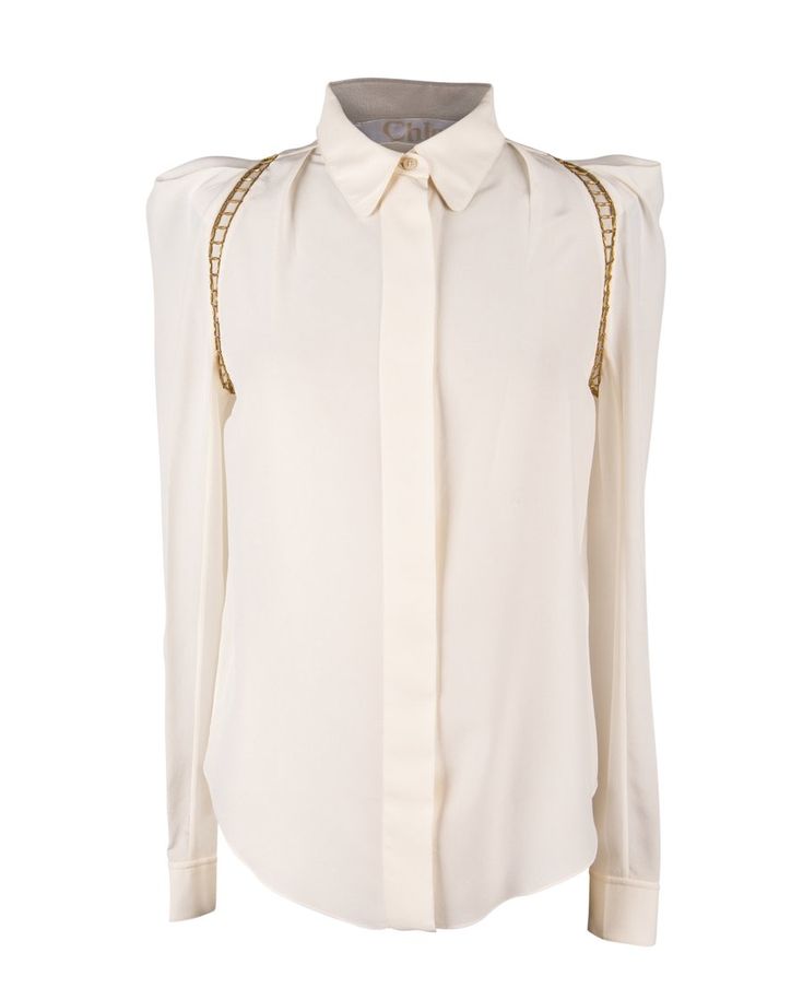 Guaranteed authentic Chloe silk top in winter white and metal open work in a brushed gold.Cutout gold hardware around the arms at shoulder area.Shoulders are shaped and accentuated.Top has hidden placket and cuffs have 1 embossed button.Rounded collar.**See the matching pant listed.**This listing is the blouse onlyfina Metal Detail, Winter Tops, White Blouse, Winter White, Silk Top, Tapered Legs, Gold Hardware, Metal Working, Leg Pants