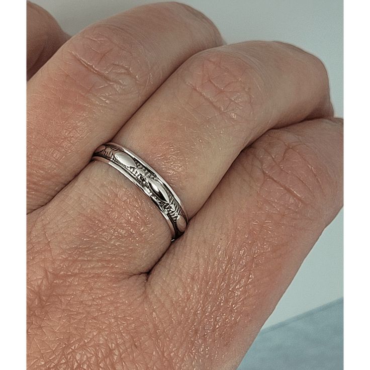 Wear a sleek and sophisticated take on the diamond-pattern taken from the 16th-century Italian theater, Commedia dell'arte, that became popular in the 1920's in this harlequin ring band that is made specifically for you. Each ring is handmade specifically for you where a band of recycled sterling silver is hand-wrought and etched with an elongated marquise-shaped harlequin design that encircles the entire band that is oxidized and hand-polished to bring out the vintage detail. Timeless Silver Stackable Rings With Rose Cut Diamonds, Silver Stackable Rose Cut Diamond Rings, Adjustable Silver Ring With Single Cut Diamonds, Adjustable Silver Rings With Single Cut Diamonds, Timeless Stackable Engraved Ring For Anniversary, Timeless Ring With Decorative Band For Promise, Formal Stackable Rings With Decorative Band, Timeless Promise Ring With Decorative Band, Sterling Silver Rings With Decorative Band