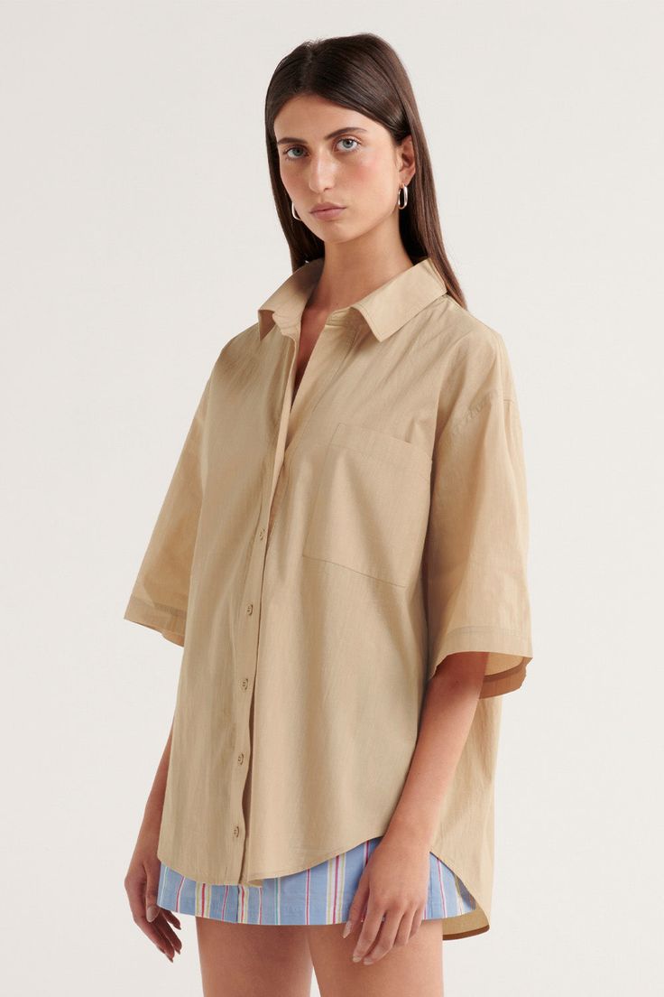 Our Sunday by s t e e l e . collection is a carefully curated range of effortless and easy to wear pieces designed for slow days and everyday use.Elevate your wardrobe with the Delia Shirt, our s t e e l e . take on the classic button-up shirt. Crafted from a crisp cotton fabric, this wardrobe essential has been thoughtfully designed in a tailored yet relaxed, oversized style. The s t e e l e . branded buttons are subtle and functional, and the gently scooped hem provides balance to the structure of the collar. Tailored, relaxed shirt Oversized design 100% cotton Subtle scoop hem Functional s t e e l e . branded buttons Functional front pocket with s t e e l e . logo stitching This style is unlined ﻿Sophie is 178cm and wears a size small. Slow Days, E Logo, Oversized Style, Wardrobe Essentials, Front Pocket, Button Up Shirts, Button Up, Size 12, Cotton Fabric