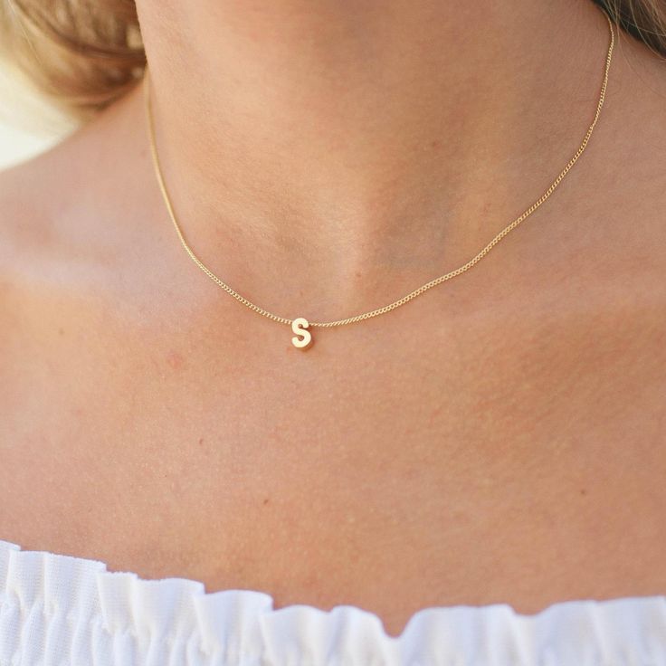 A perfect personalized piece. Add any initial of your choice to our delicate gold chain. This is the perfect gift idea for your best friend, sister, mother and daughter. …………………………………. Details: Available in Gold Plated Curb Chain Pendant is Matte Gold Plated measuring 5 x 7.5mm Size inclusive and made to order just for you Not waterproof Average necklace length is 18" About Your Jewelry If you are not wearing your jewelry it is best to store it in a cool, dry place such as your gift box that is Tiny Initial Pendant Charm Necklace For Gifts, Simple Initial Necklace With Delicate Chain, Dainty Initial Necklace With Name, Initial Pendant Name Necklace With Delicate Chain, Everyday Initial Name Necklace, Dainty Initial Necklace For Personalized Gift, Personalized Yellow Gold Initial Necklace With Delicate Chain, Dainty Initial Necklace With Delicate Chain For Anniversary, Personalized Delicate Initial Necklace