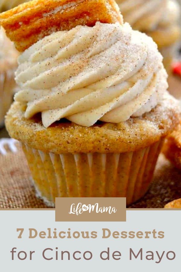 some cupcakes with icing and cinnamon on top