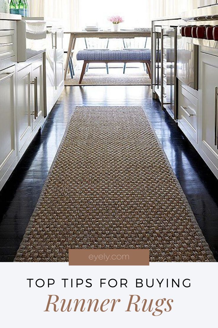 a runner rug in the middle of a kitchen