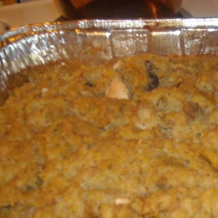 a casserole dish with meat and vegetables in it, ready to be eaten