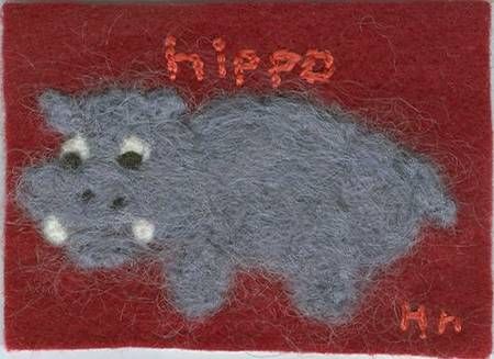 a needled hippo on a red background with the word hippop in it