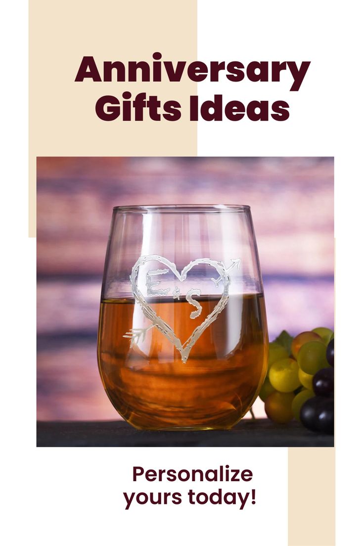 a wine glass with a heart on it and grapes in the background, says anniversary gifts ideas personalize yours today