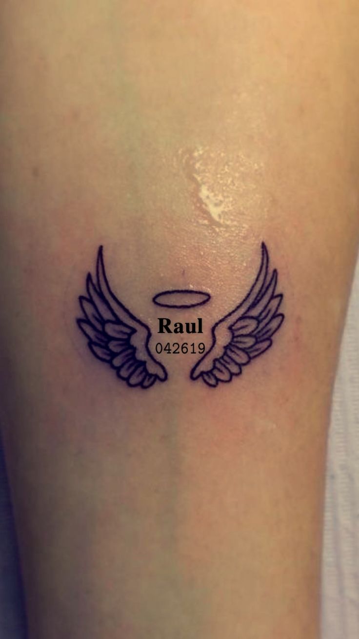 a small tattoo on the leg of a woman with wings and an inscription that reads paul